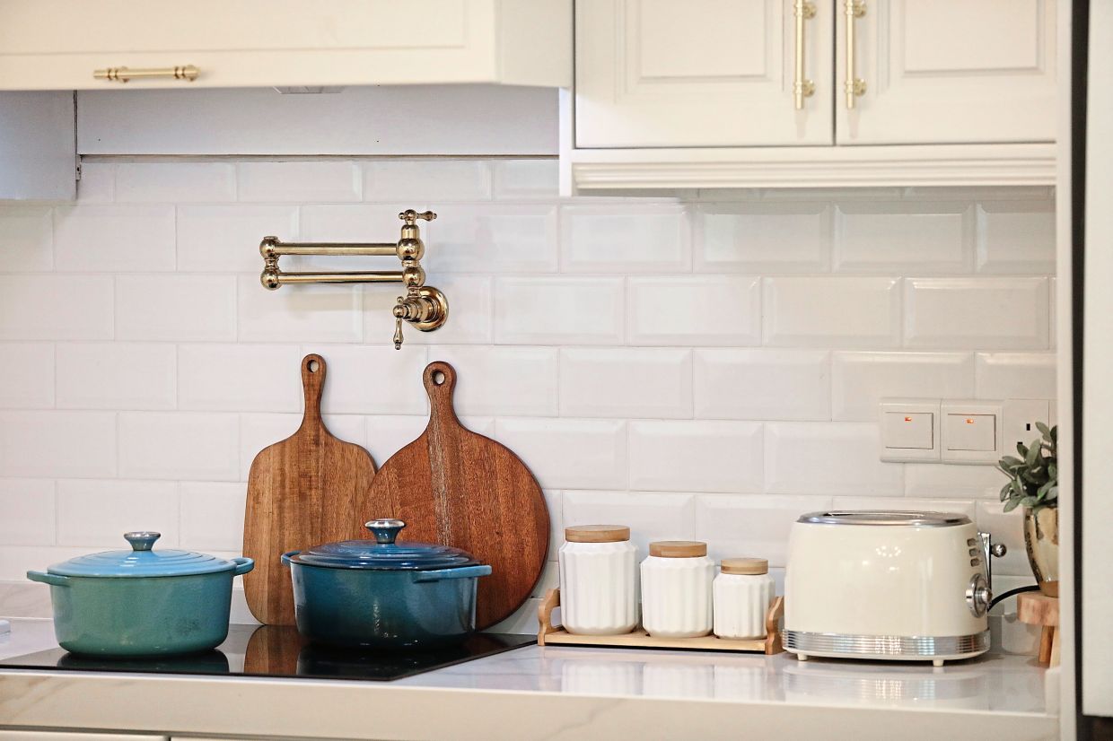 The creamy white cabinetry adds classic charm to the serene dining space.