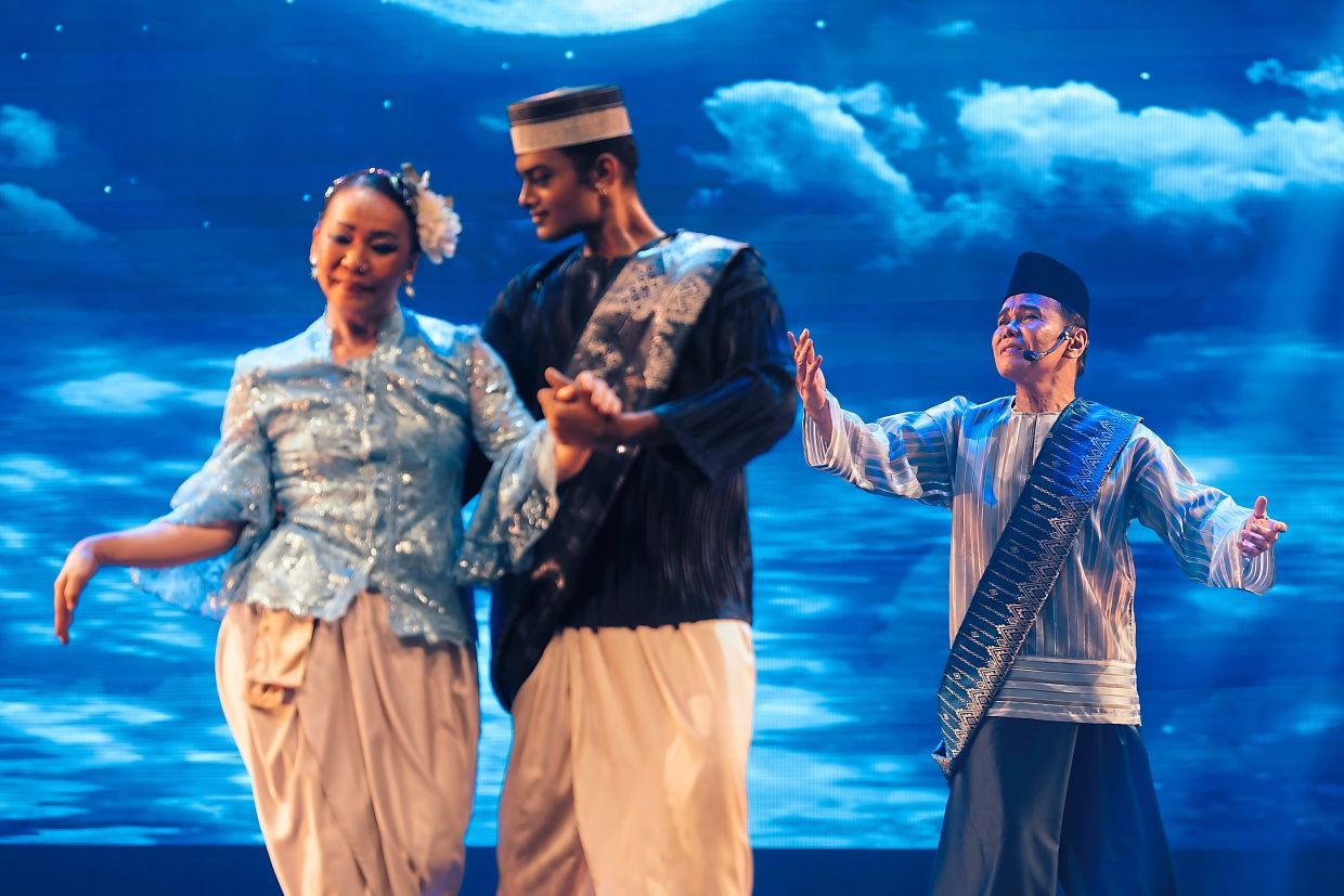 Ramli (right) with dancers in the performance.