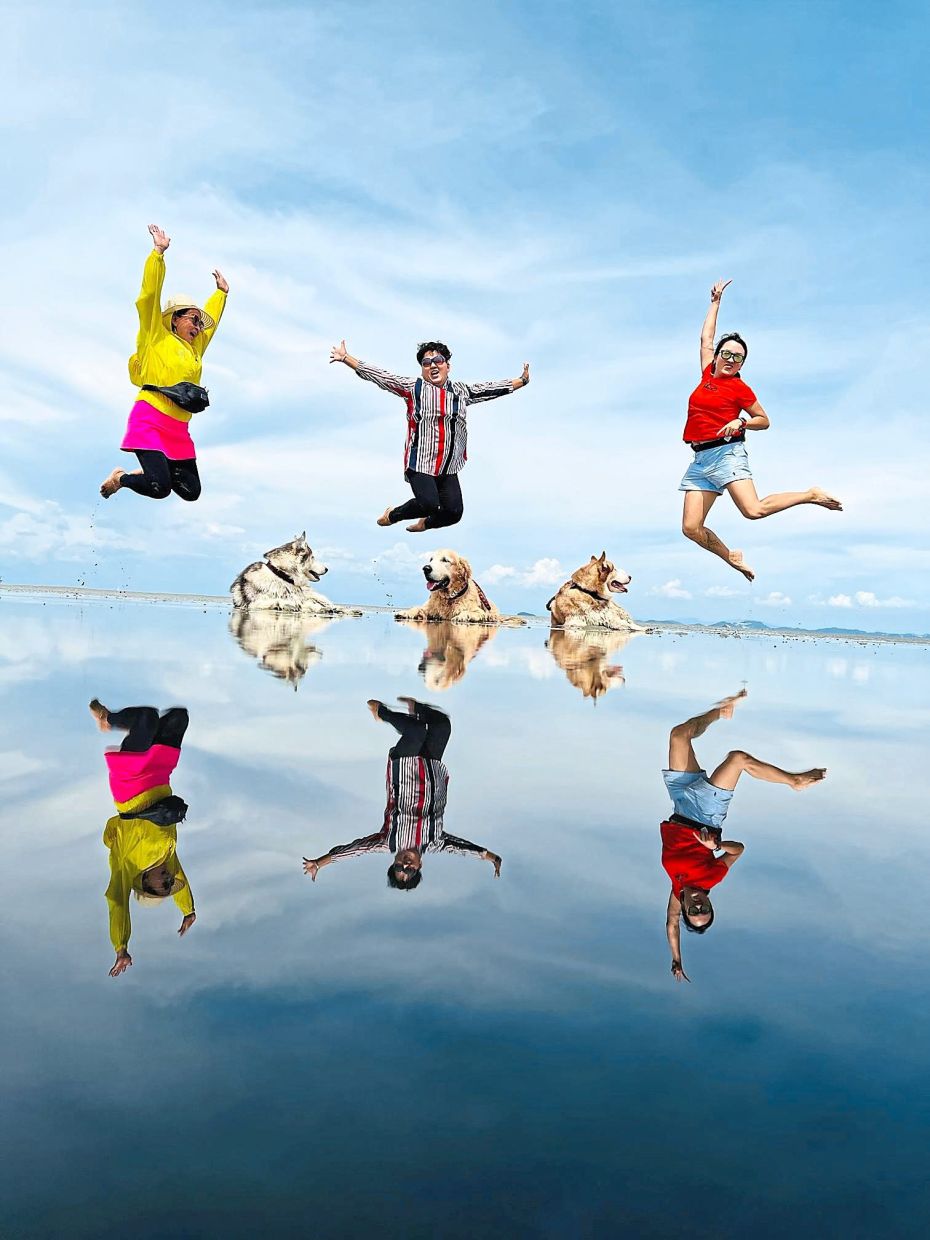 Loo (right) on one of her trips to the beach with her friends and her dogs.