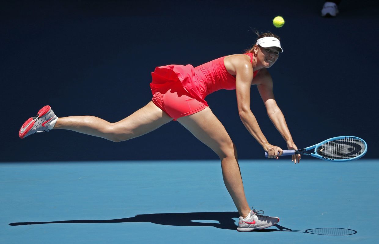 A 2020 file picture shows Russia's Maria Sharapova making a backhand return at the Australian Open tennis championship in Melbourne. Photo: AP