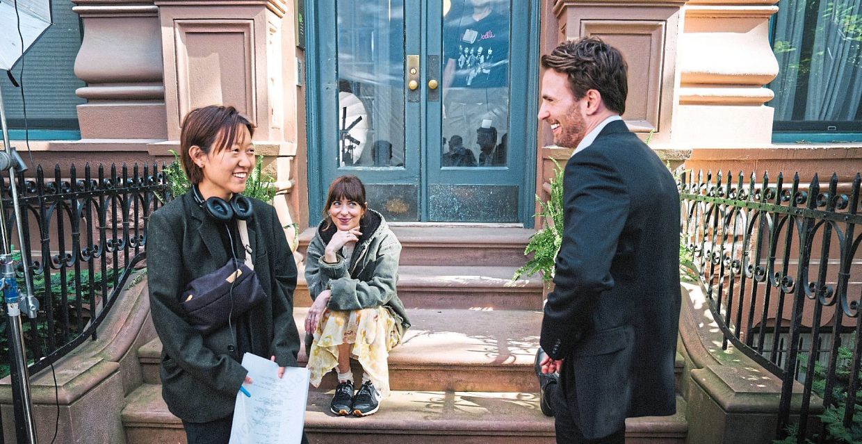 Song (left) on location in New York with her actors, Johnson and Evans (right).