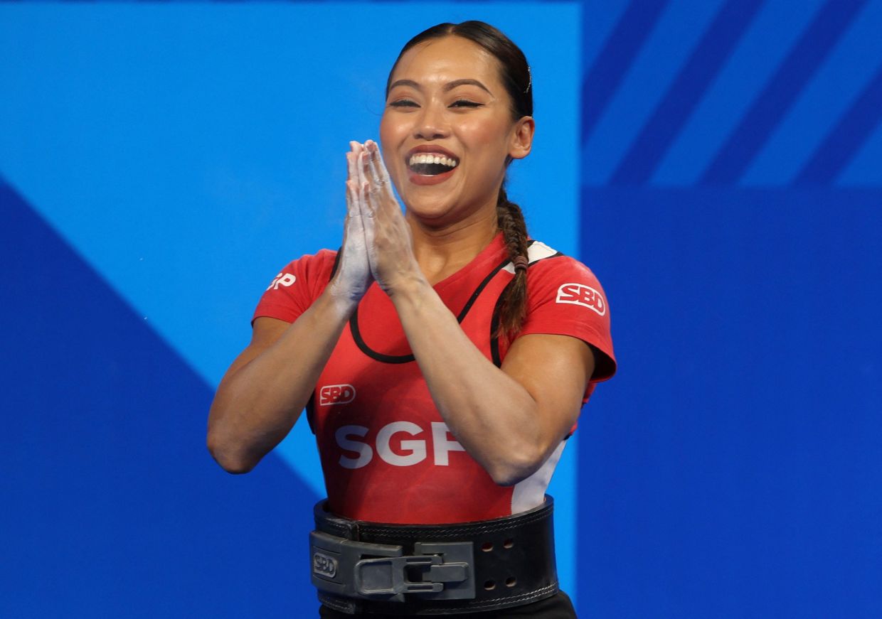 The World Games Chengdu 2025 - Powerlifting - Women's Lightweight - Final - Hi-Tech Zone Sports Centre Gymnasium - Chengdu, China - August 14, 2025 -- Singapore's Farhanna Farid reacts after a successful lift. -- Photo: REUTERS/Go Nakamura