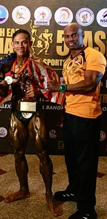 National coach Datuk Mohd Syarul Azman Mahen Abdullah with his protege Aziz Ahmad.