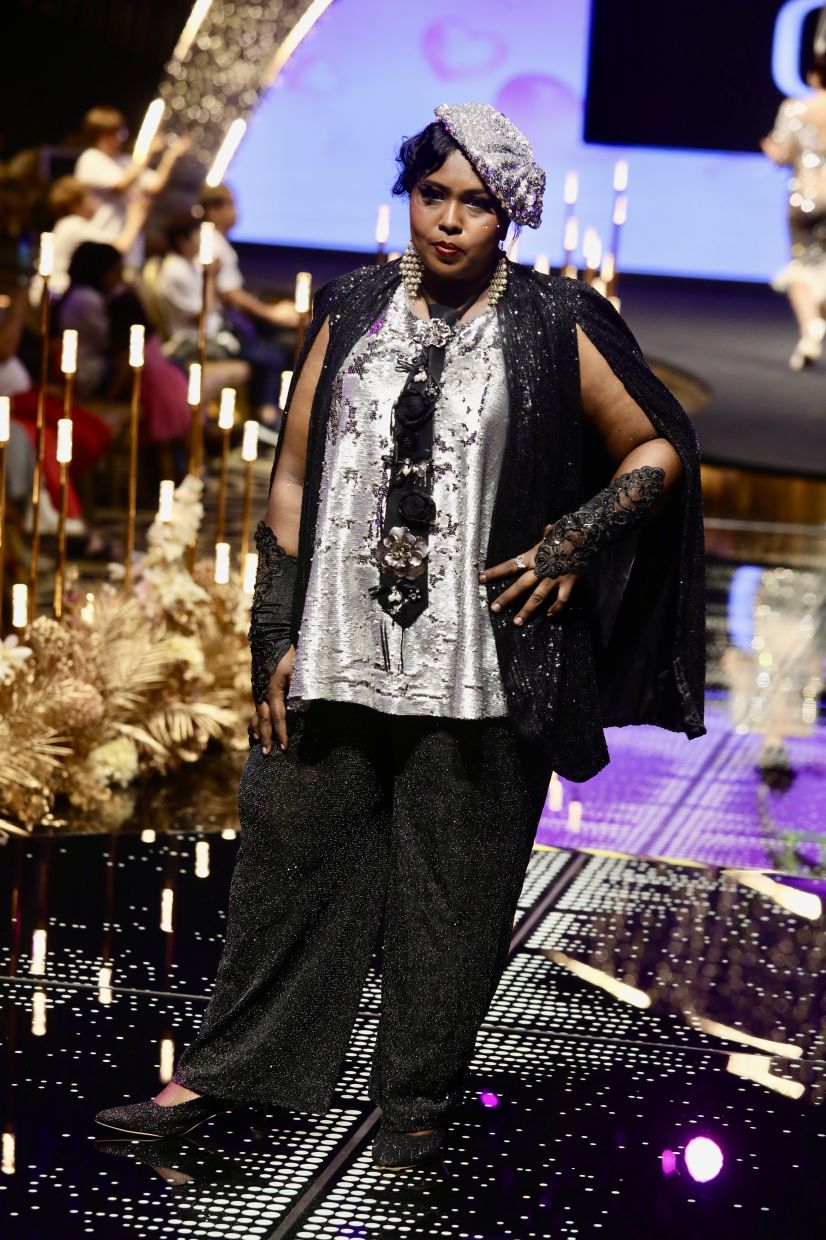 Vimala Thevi, a two-time breast cancer survivor, striking a pose in a shiny design by Gilbert Headhunter.