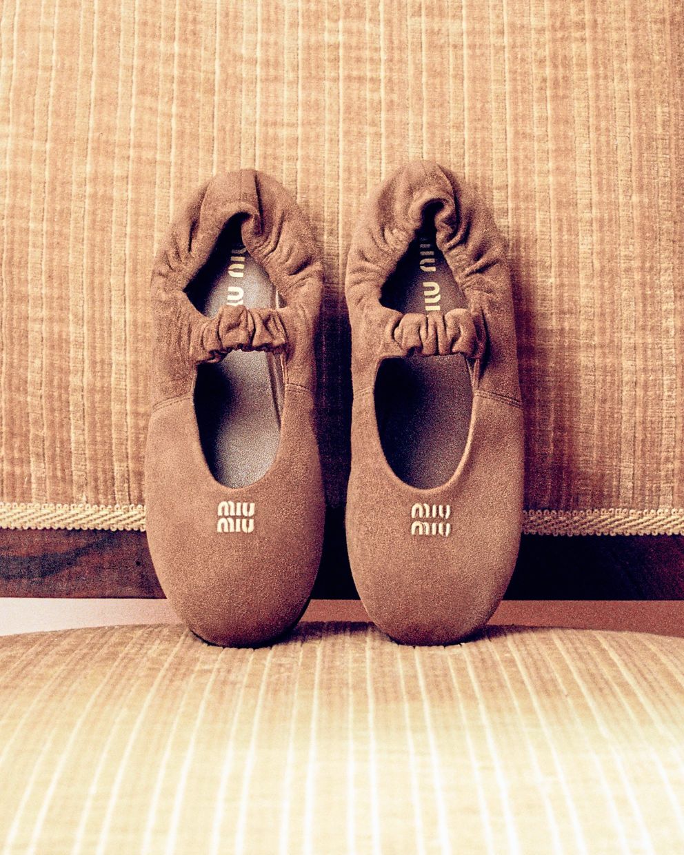 This light, elegant pair has gathered details and is in soft suede.Photo: Miu Miu