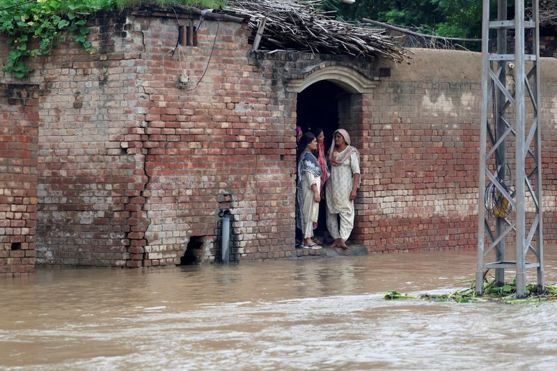 India warns foe Pakistan of potential flooding as both battle torrential rains