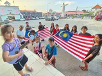 Kids strum ukuleles for National Day reviving centuries-old traditions
