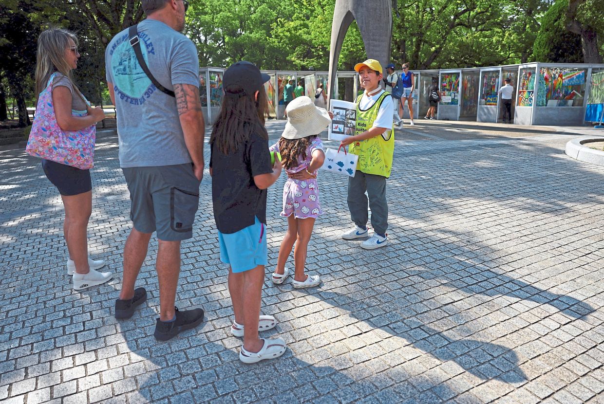 His volunteer work has earned him the honour of being selected as one of two local children to speak at this year's ceremony to commemorate 80 years of the event. Photo: ISSEI KATO/Reuters