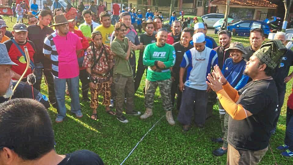Adib (right) is seen giving a briefing at one of the outdoor archery events organised by Archer’s Studio.