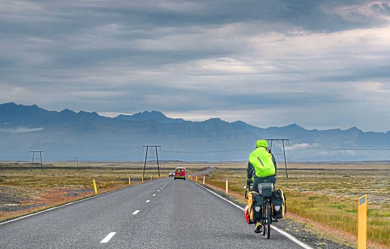 Cycling Iceland’s Ring Road offers vast horizons, shifting weather, and the steady rhythm of a volcanic journey.