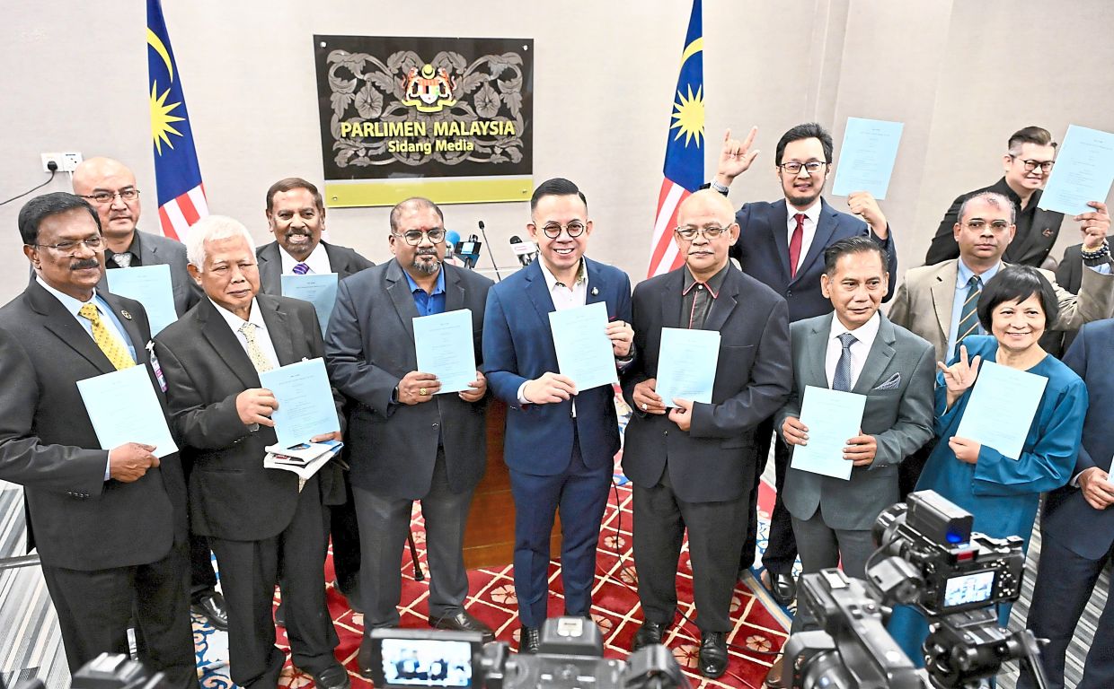 All-inclusive: Sim with stakeholders after a press conference regarding the Gig Workers Bill at the Parliament building. — RAJA FAISAL HISHAN/The Star
