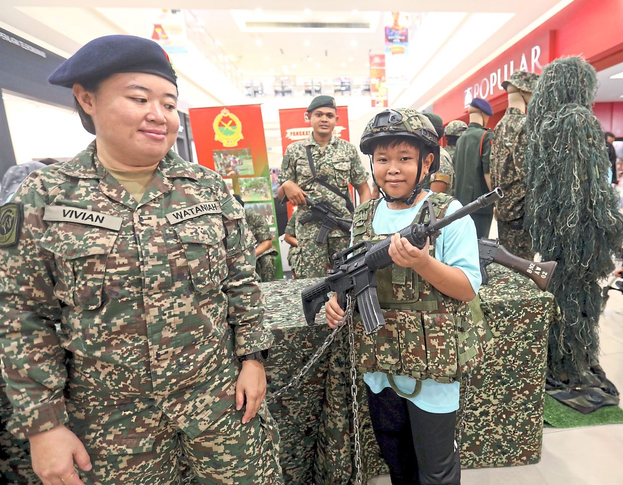 A youngster at the Territorial Army booth.