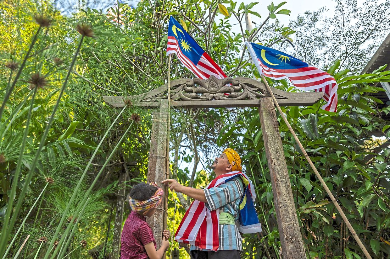 Mohamad Salleh does not pass up the chance to decorate his home in Kota Baru, Kelantan, as a show of patriotism.