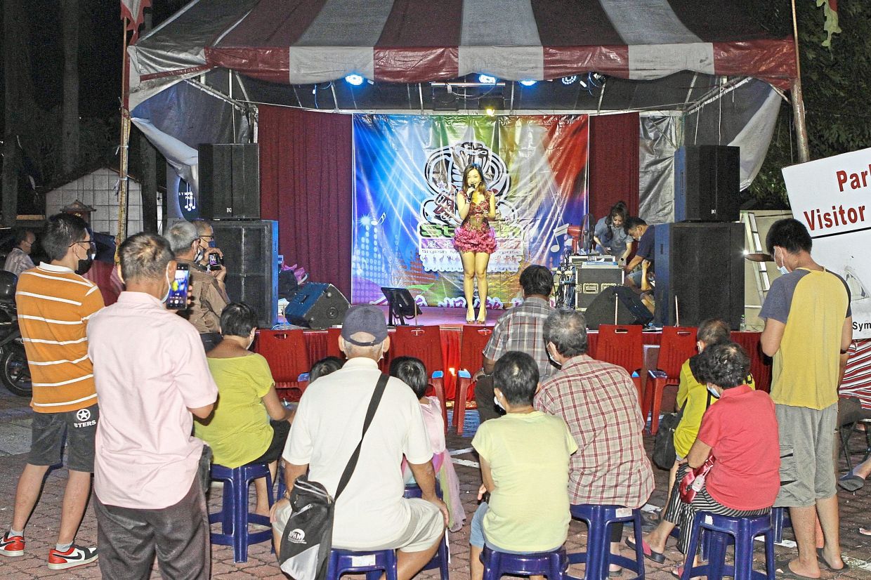 A getai performance during the first day of the festival at Symphony Park in Jelutong.