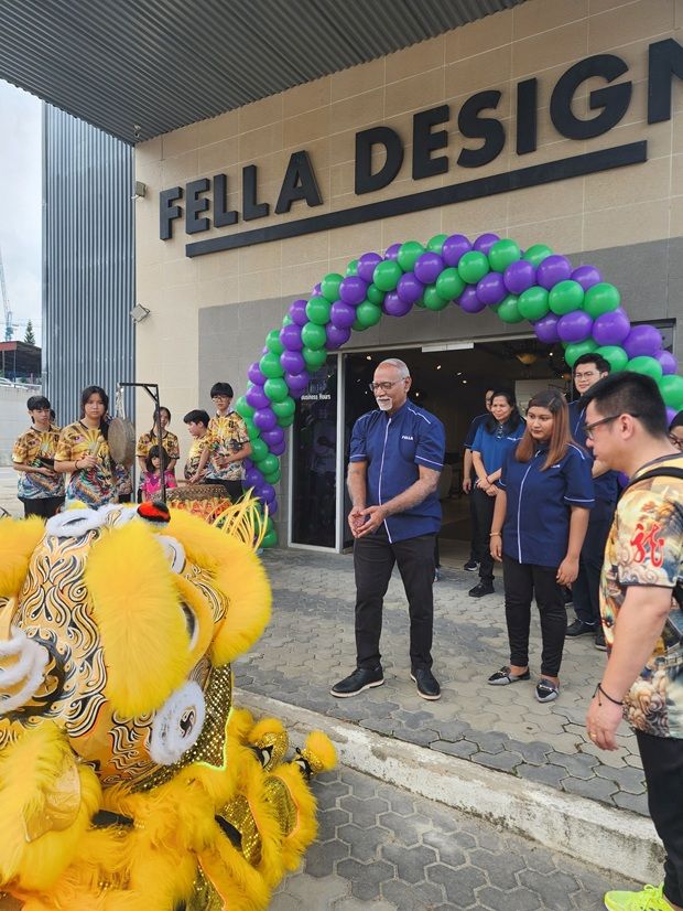 Fella Sales and Services senior operation manager Jeya Kumar Jaganathan interacting with the lion dance troop during the opening ceremony.