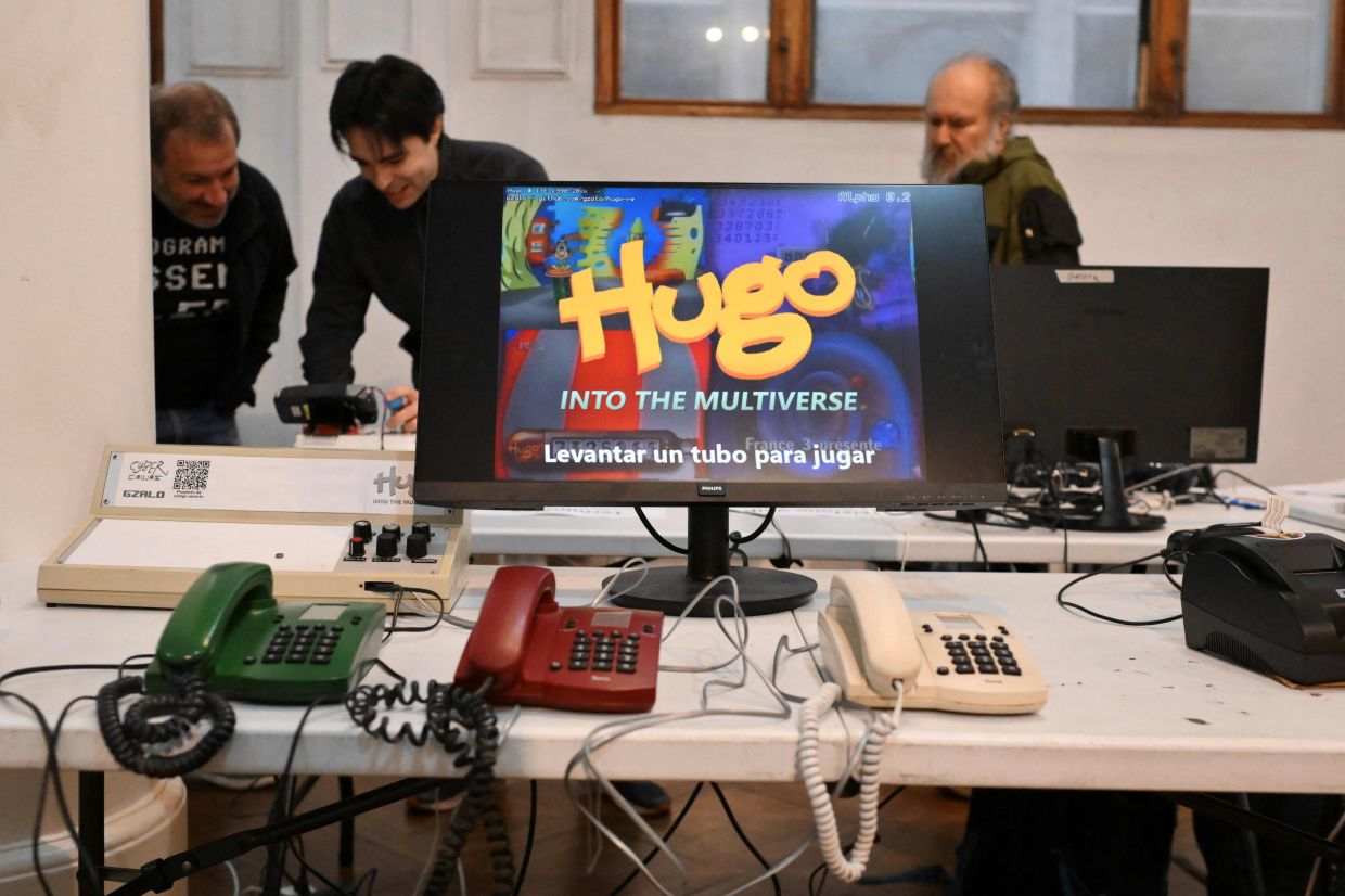 A video game built from recycled and disused electronic components and operated via analogue telephones is photographed during the 3rd Federal Cyberciruja Meeting in Buenos Aires, on Aug 16, 2025. — AFP