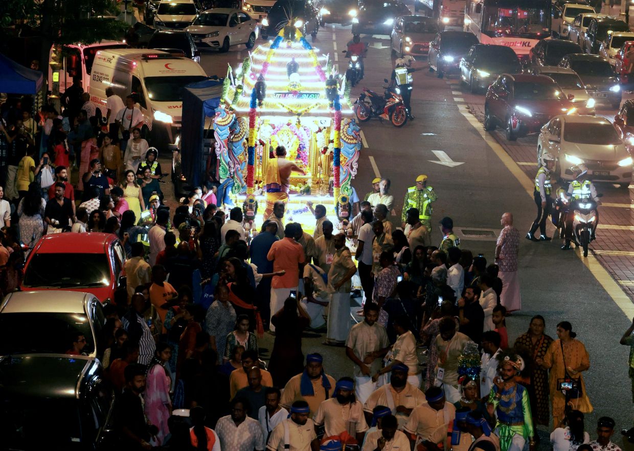 Devotees taking part in the procession to honour Ganesha–KAMARUL ARIFFIN/TheStar