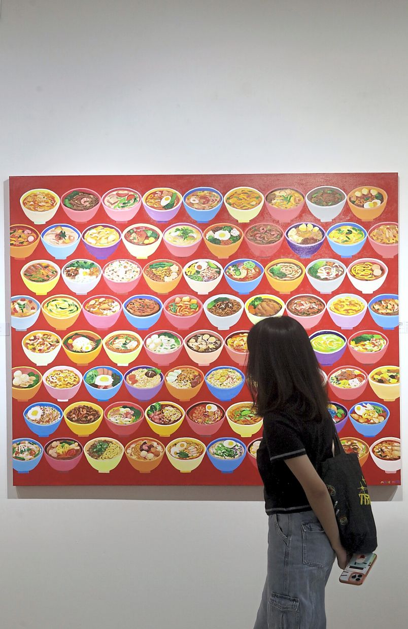 At the G13 Gallery in Petaling Jaya, Ho’s 'Bowls Of Malaysia' artwork highlights the country’s diverse noodle flavours and rich food culture – from curry laksa and kolo mee to ‘maggi sup’ and beyond. Photo: The Star/Samuel Ong