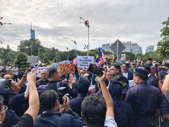 URA protestors gather outside Parliament again