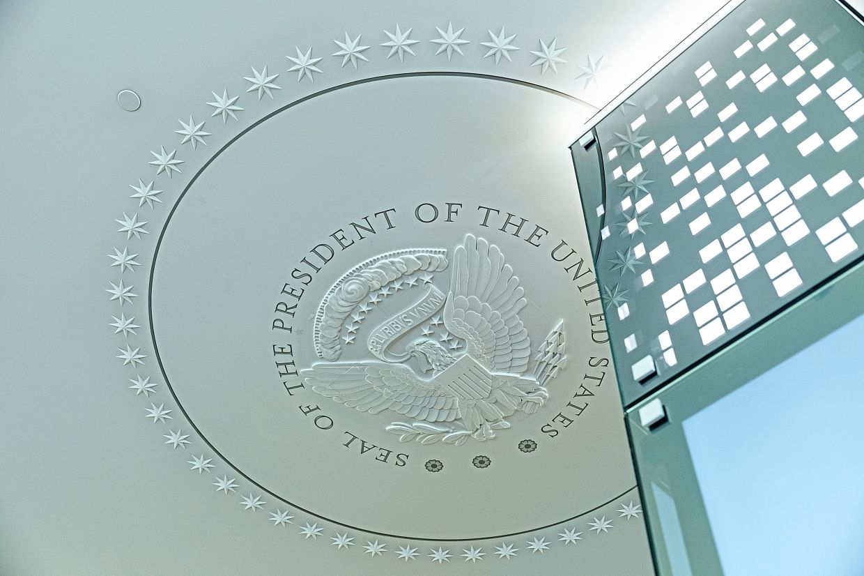 The presidential seal on the ceiling inside the Oval Office replica.