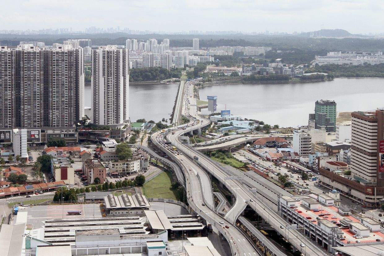 Maybank has established a specialised desk to assist businesses with cross-border account openings, regulatory approvals, and setup processes in both Johor and Singapore. — THOMAS YONG/The Star