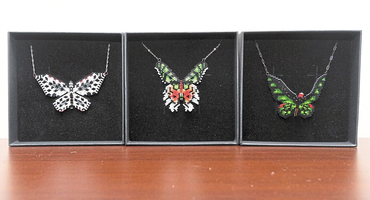Delicately crafted butterfly pendants, designed with colourful beads.