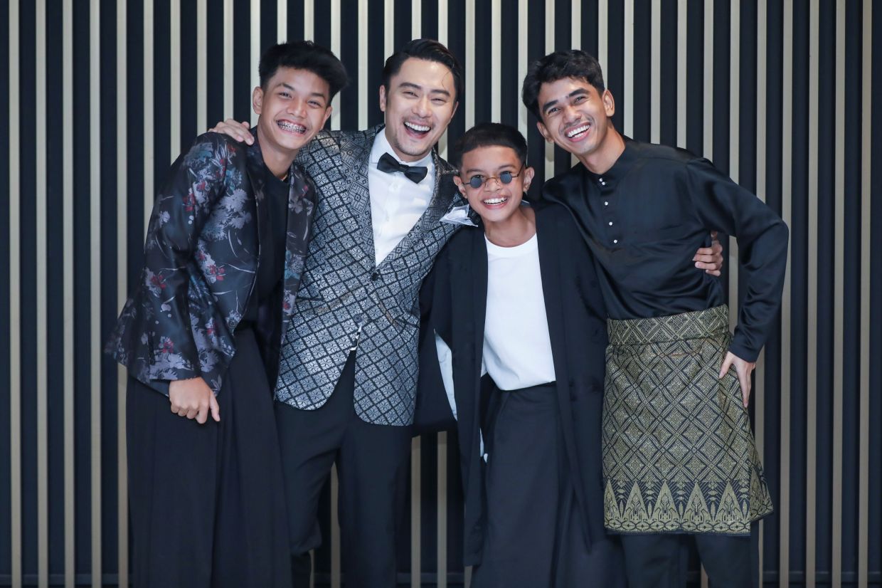 Andy Teh with the three young actors who play his sons in Abah Saya Uncle Mike. Photo: Handout
