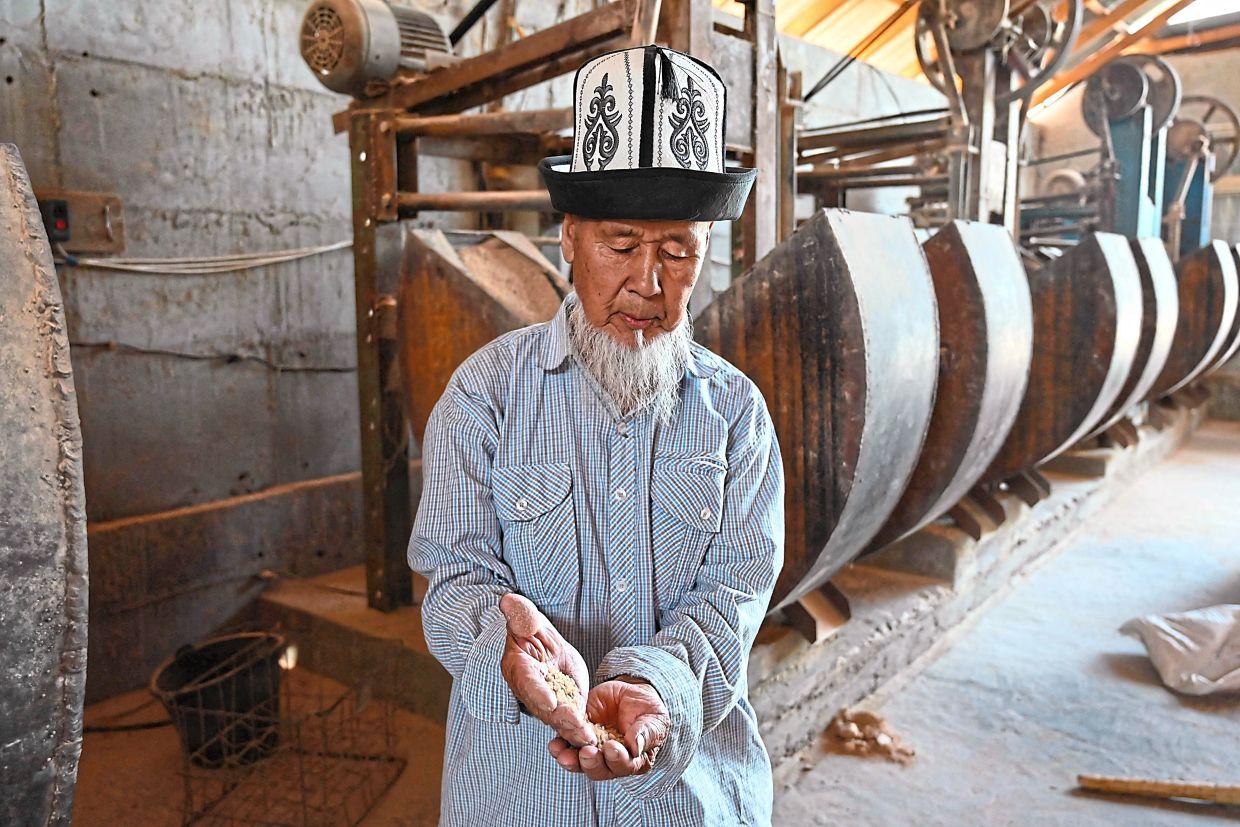 Saparov at the processing facility of his rice farm in the Batken region.
