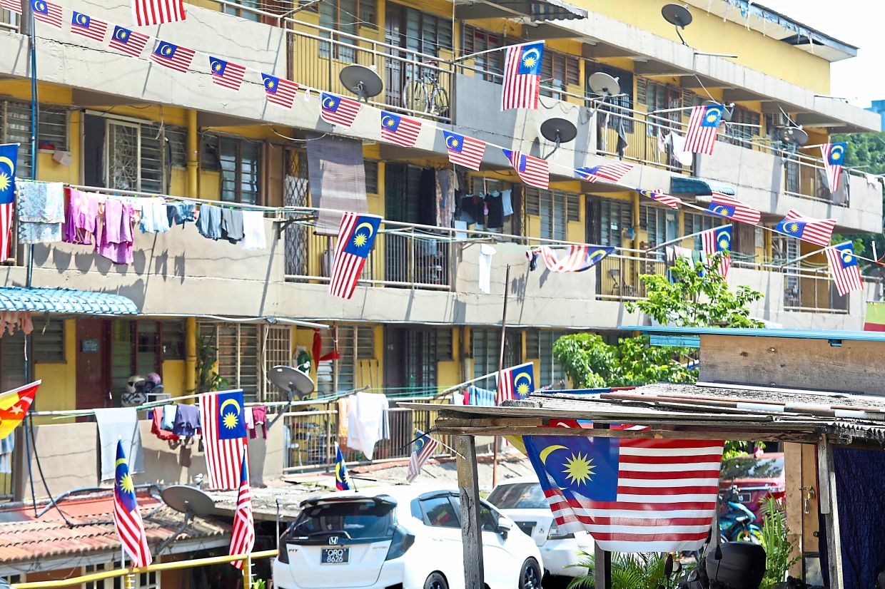 Rumah Pangsa AU2 in Taman Keramat is adorned with Jalur Gemilang to mark the nation’s 68th National Day.