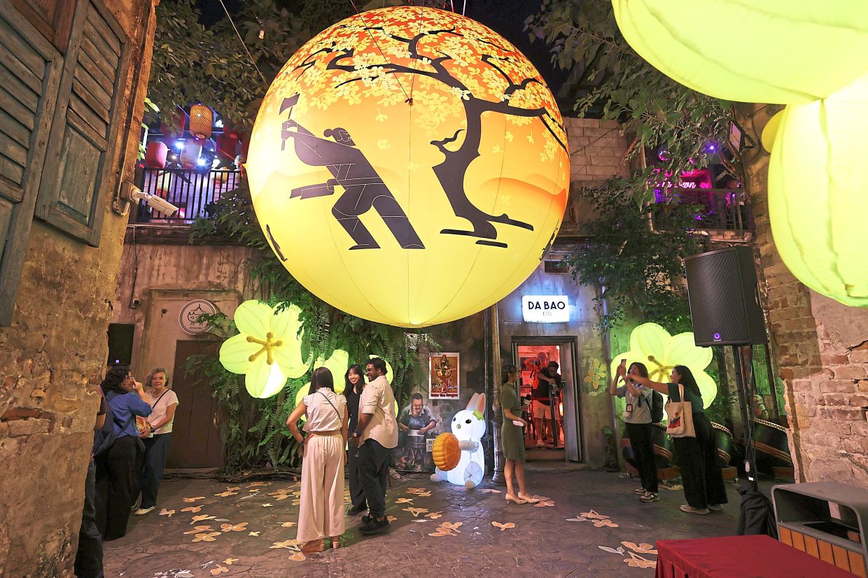 'Moonlit Blossom' will be showing at the Kwai Chai Hong lane until Oct 12. Photo: The Star/Glenn Guan
