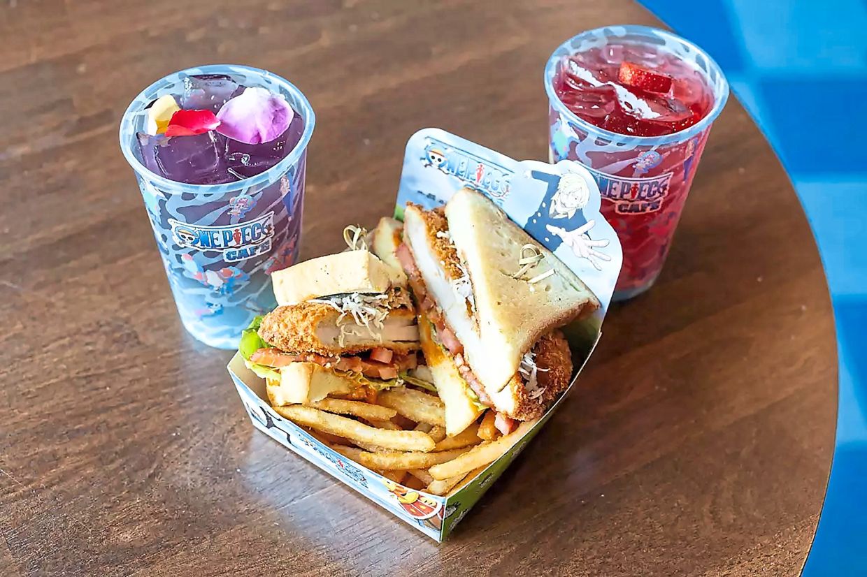 Fans come for the One Piece-inspired menu with items such as Sanji’s Diable Jambe Chicken Katsu Sando with Robin’s Flower-Flower Power Refresher (left), and Dragon Fruit Strawberry Punch.