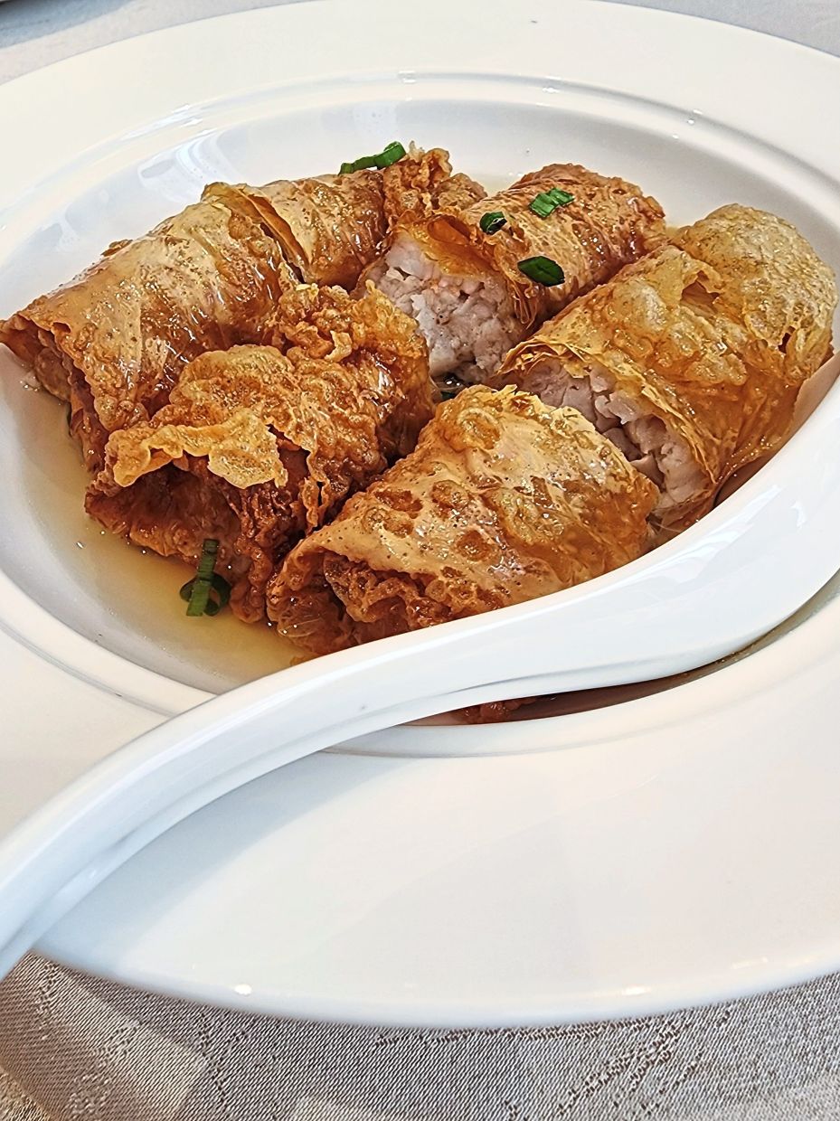 In this dim sum offering, crisp beancurd rolls are stuffed with pork and given a little liquid bath, courtesy of the chicken broth in this amalgamation. — ABIRAMI DURAI/The Star