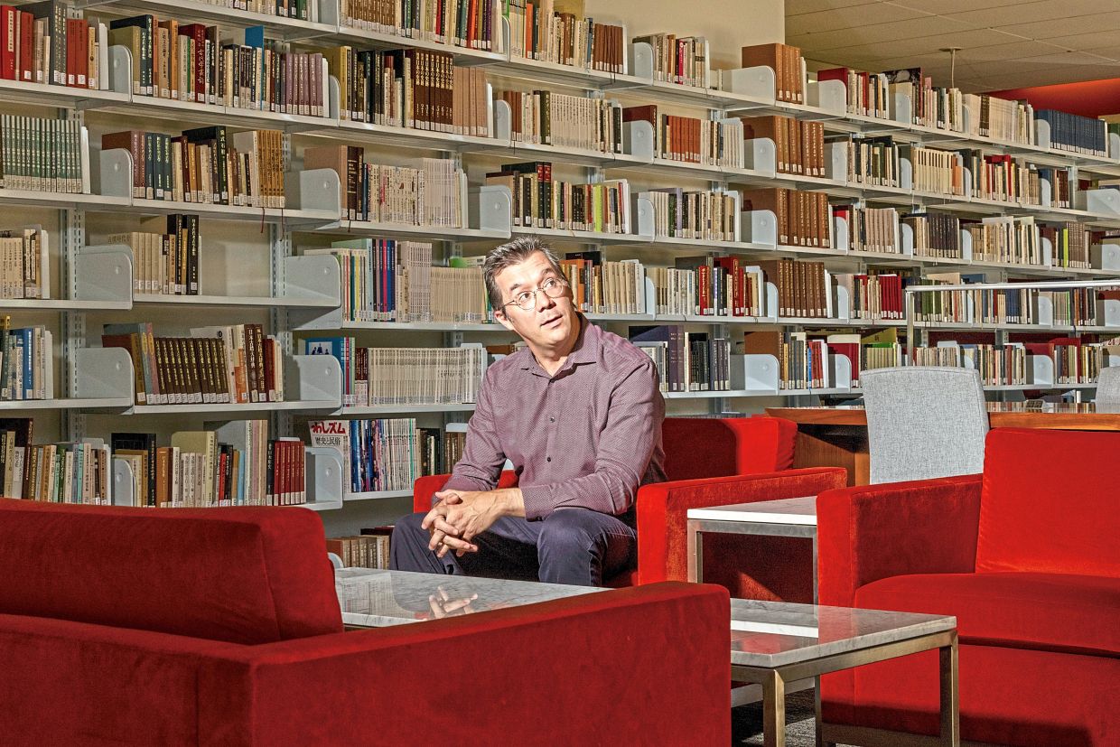 Mullaney, a Chinese history professor who has become an expert on Chinese typewriters, at Lathrop Library. — Christie Hemm Klok/The New York Times