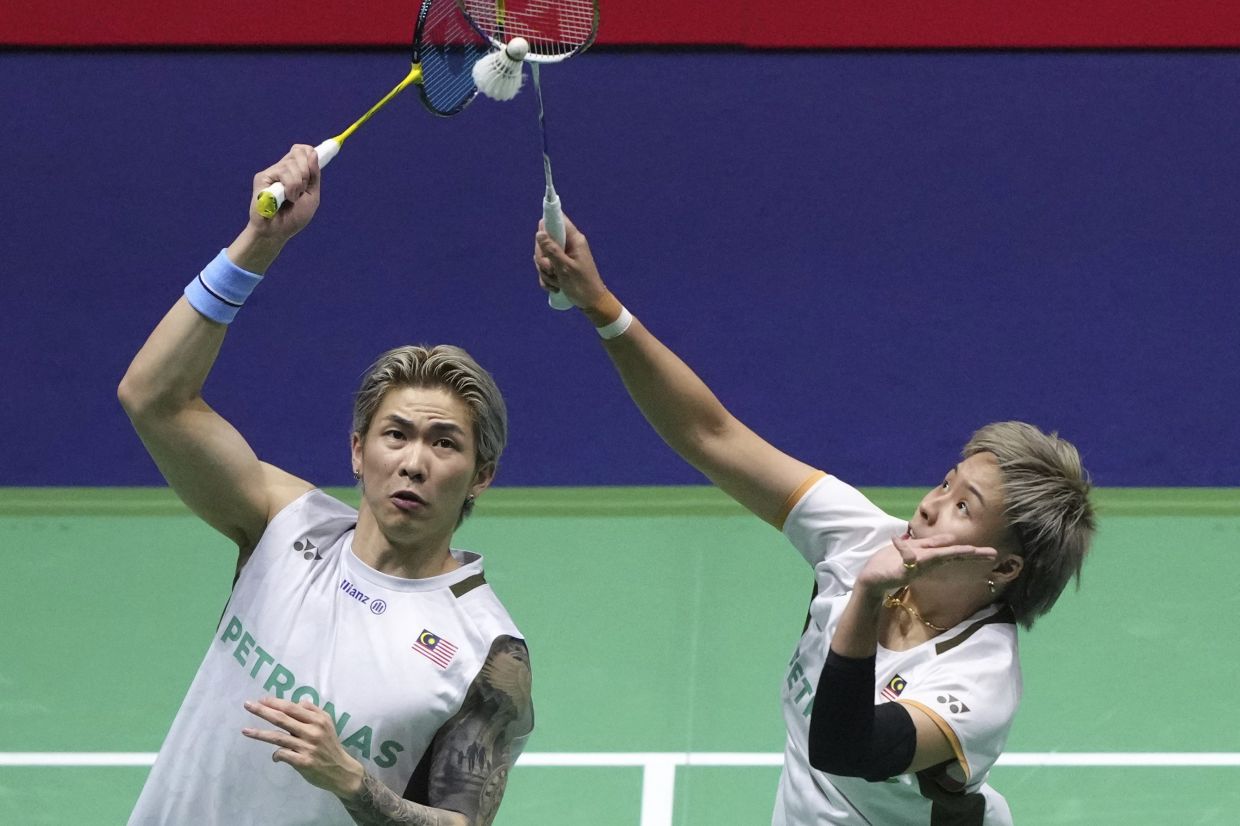 Chen Tang Jie (left) and Toh Ee Wei, of Malaysia, return a shot to Thom Gicquel and Delphine Delrue, of France, during their Mixed Doubles semifinal match of the Badminton World Championships, Saturday, Aug. 30, 2025, in Paris. -- AP Photo/Aurelien Morissard