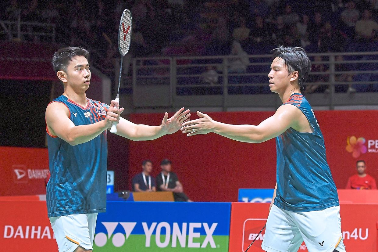 Sze Fei-Izzuddin celebrating after winning a point against Taiwan’s Chen Zhi-ray-Lin Yu-chieh.