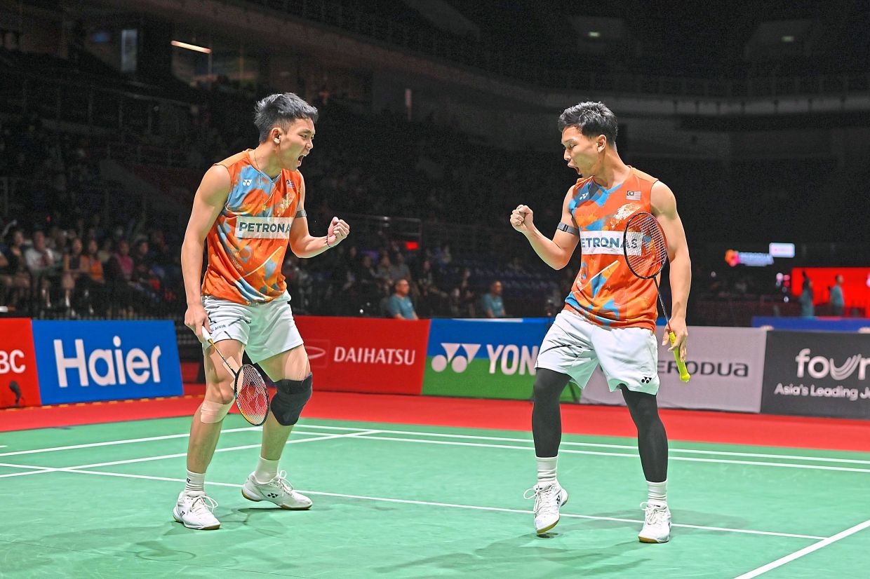 Roy King-Arif celebrating after winning a point against Denmark’s Rasmus Kjaer-Frederick Sogaard.