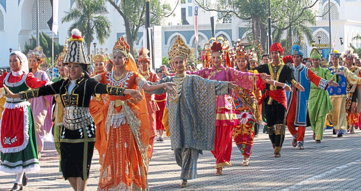 Dancers celebrating the 51st Merdeka with a colourful parade in Kuantan, Pahang. — NIK NAIZI HUSIN/The Star