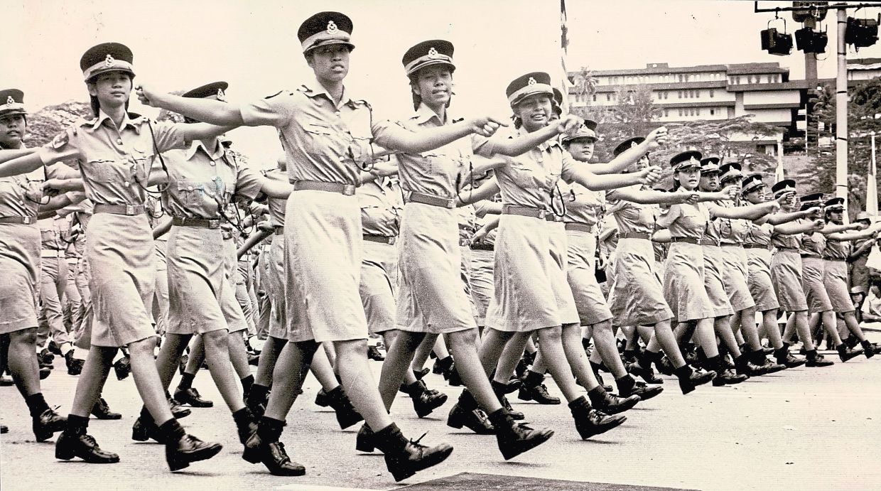 With boots in sync and pride in stride, female police cadets made a striking sight as they marched through Kuala Lumpur during the parade. — MOK YONG/The Star