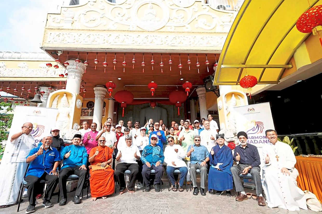 Faith leaders and participants gathering for a group photo during the ‘Jejak Harmoni’ programme at a Buddhist temple in Sentul, Kuala Lumpur;