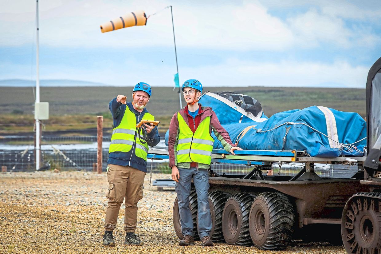 Doherty and intern Jacob Hamilton preparing to launch the Kitepower Kites. — AFP