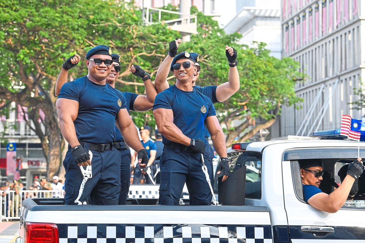 Road Transport Department (JPJ) contingent during the 68th National Day celebration at Putrajaya on Sunday. — IZZRAFIQ ALIAS/The Star