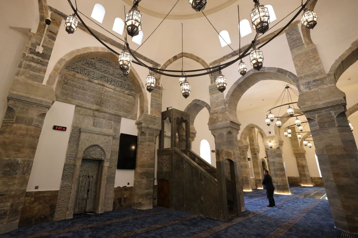 A man stands inside the historic Great Mosque of al-Nuri in the old city of Mosul, Iraq. Photo: AFP 