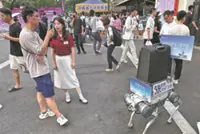 Warm welcome from robotic dogs wows students in Hangzhou