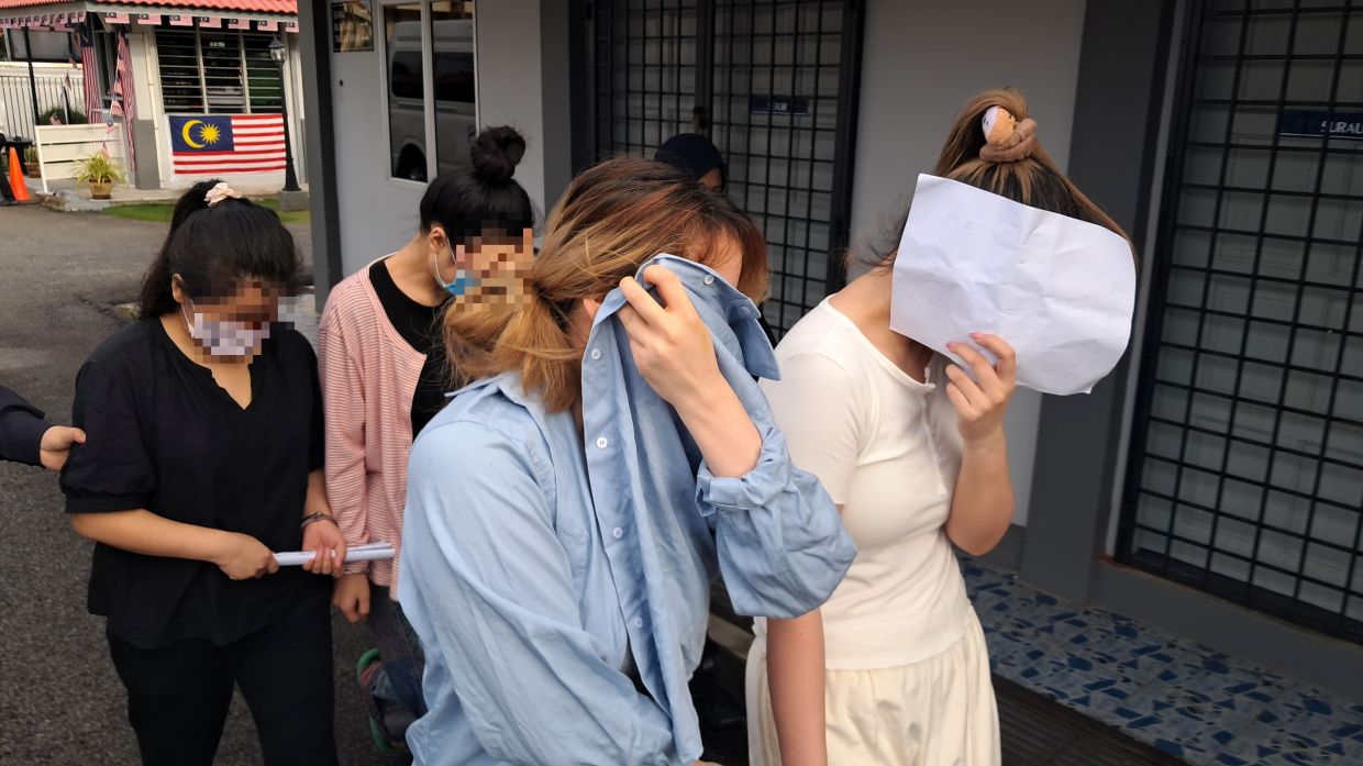 The female accused being taken to court to be charged for the offence.