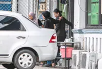 Woman who rushed Perak Ruler remanded