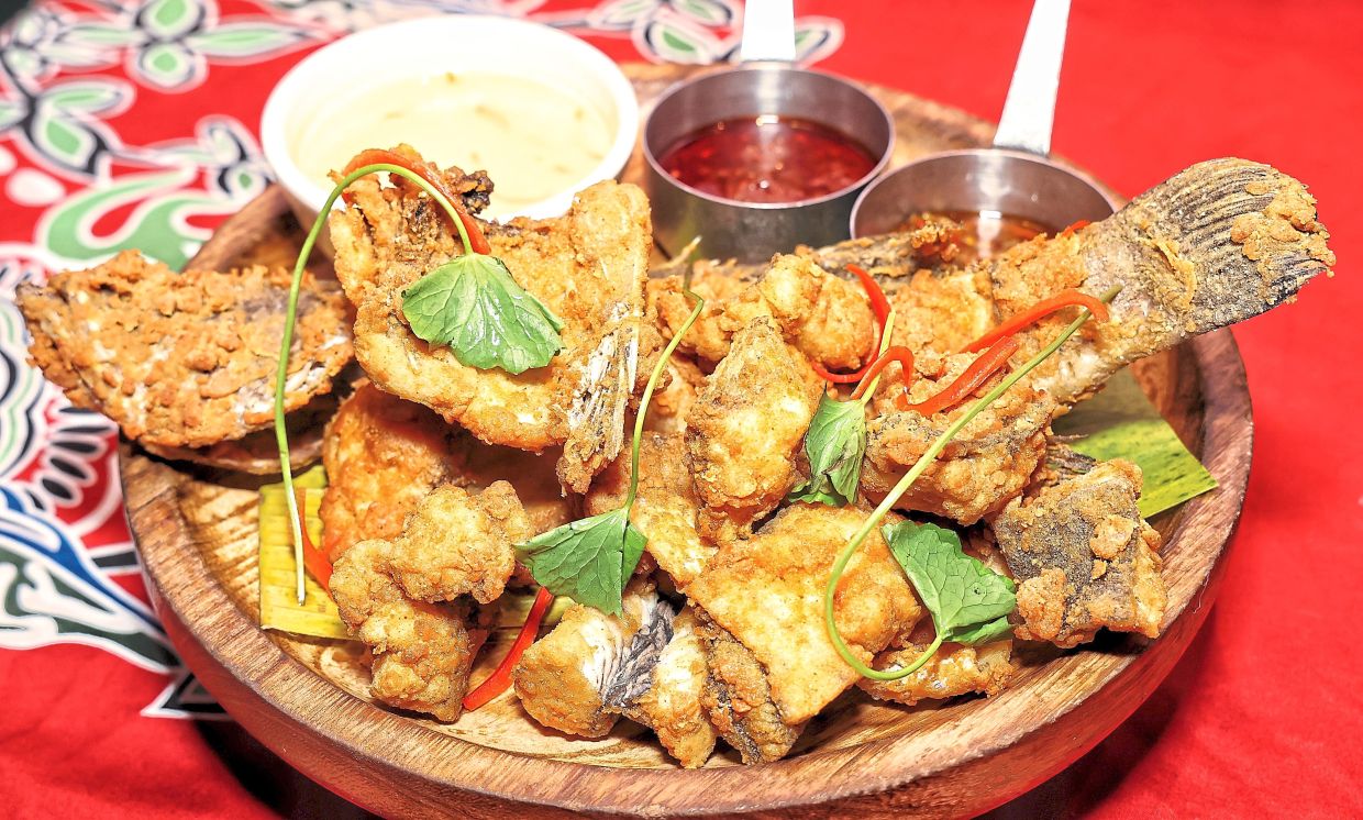 The Flying Sea Bass fried to perfection. — Photos: MUHAMAD SHAHRIL ROSLI/The Star