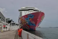 Crew of Genting Dream cruise liner rescue person on boat in Straits of Malacca