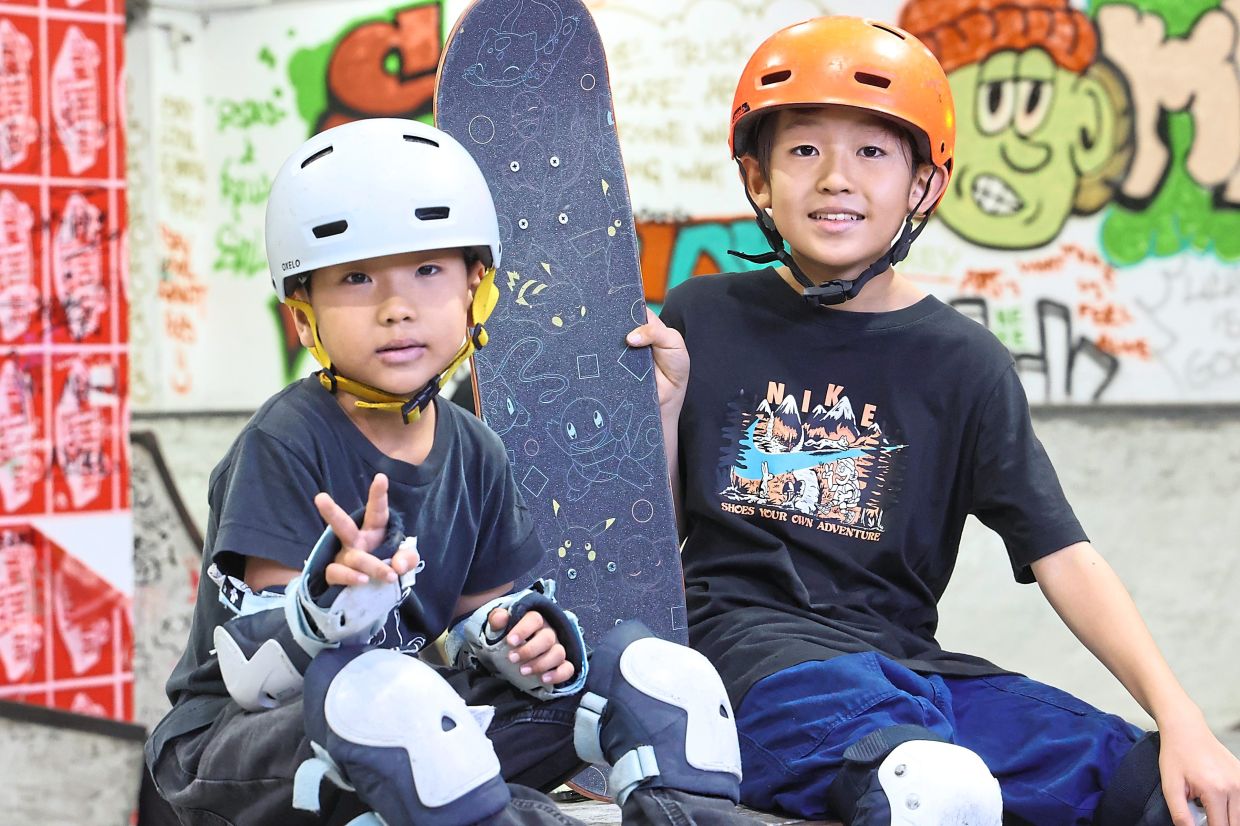 Waku (right) and his younger brother Shu, eight, are among those attending classes at the Showroom in Paradigm Mall, Johor Baru.