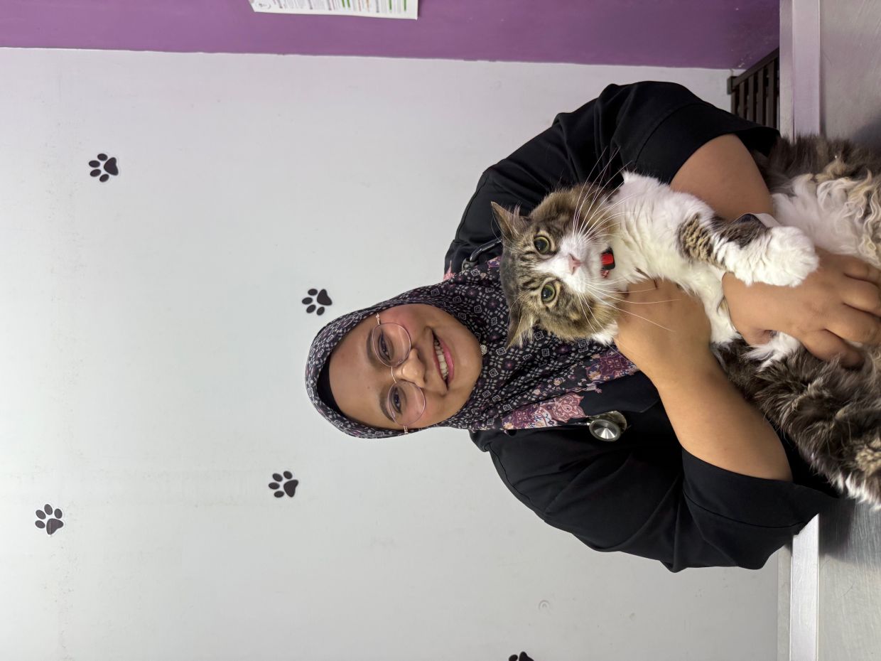 Julida Ezatul with Amat Asyraf, 11, which she adopted 11 years ago. Photo: Dr JULIDA EZATUL JALIL