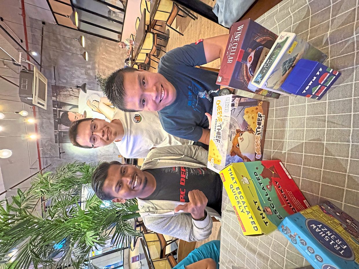 Tabletop games bring people from all walks of life together. Photo: The Star/Ming Teoh
